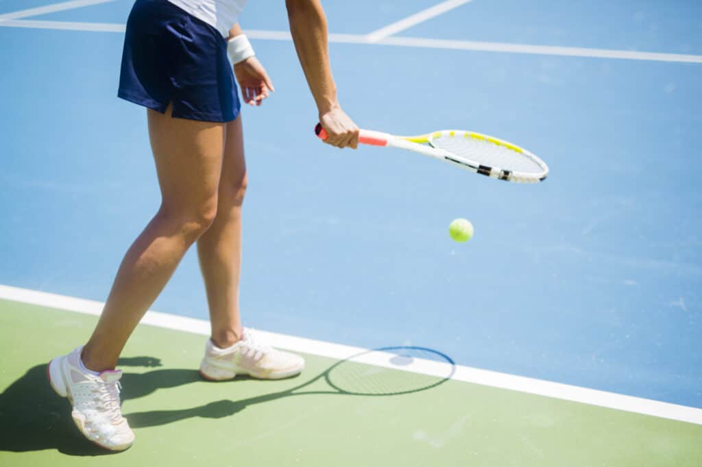 Why do tennis players bounce the ball before they serve